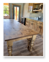 Custom built dining table in the Classic Farmhouse style built by Cattle Bend Woodworks.